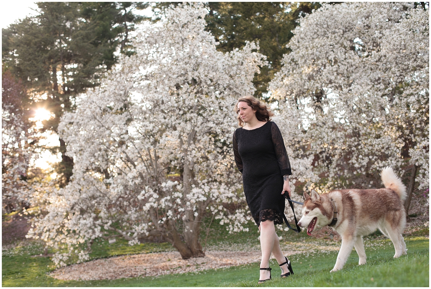 Woman walking dog at arboretum