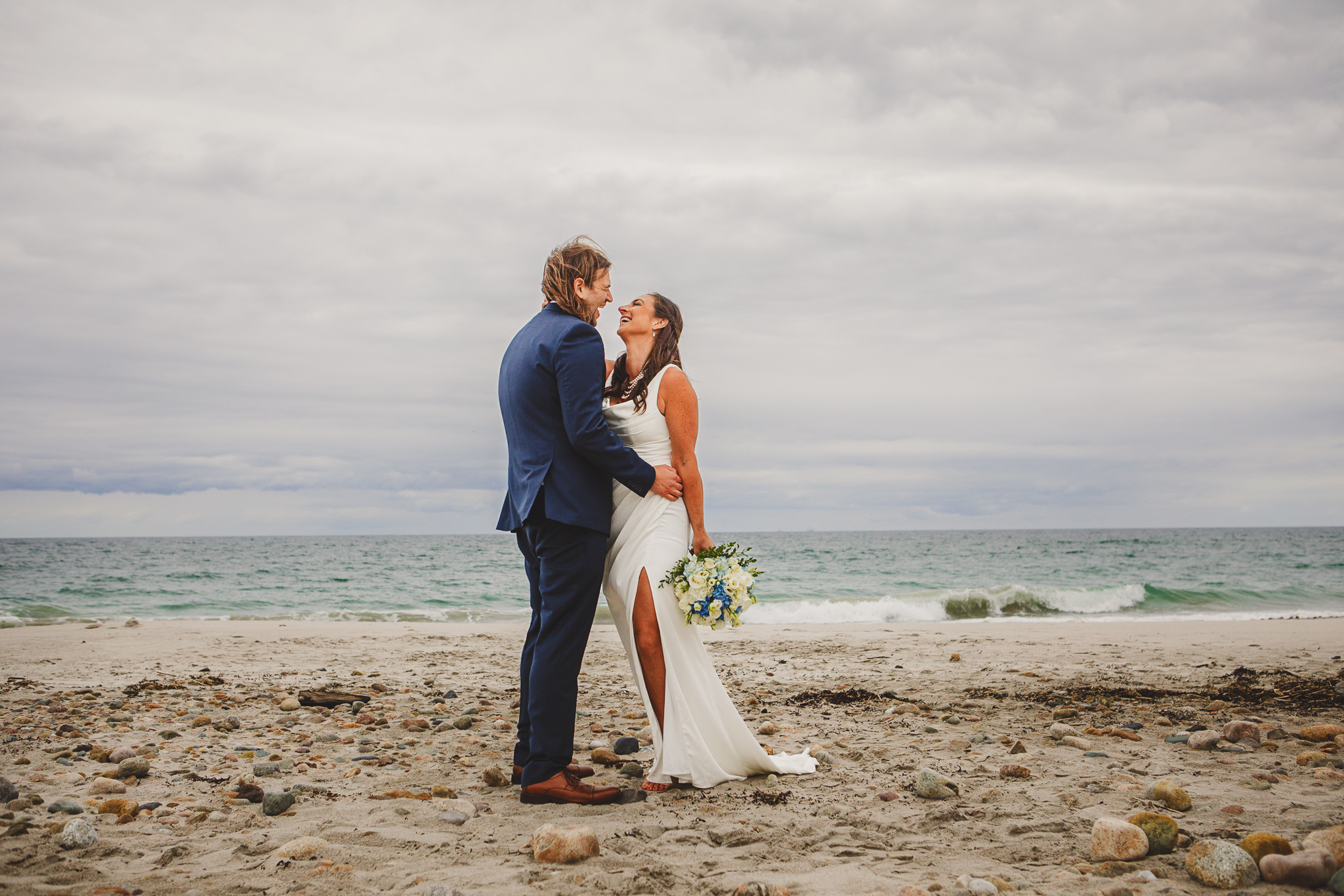 Photo of bride and groom at Duxbury Beach before wedding ceremony at Duxbury Bay Maritime School