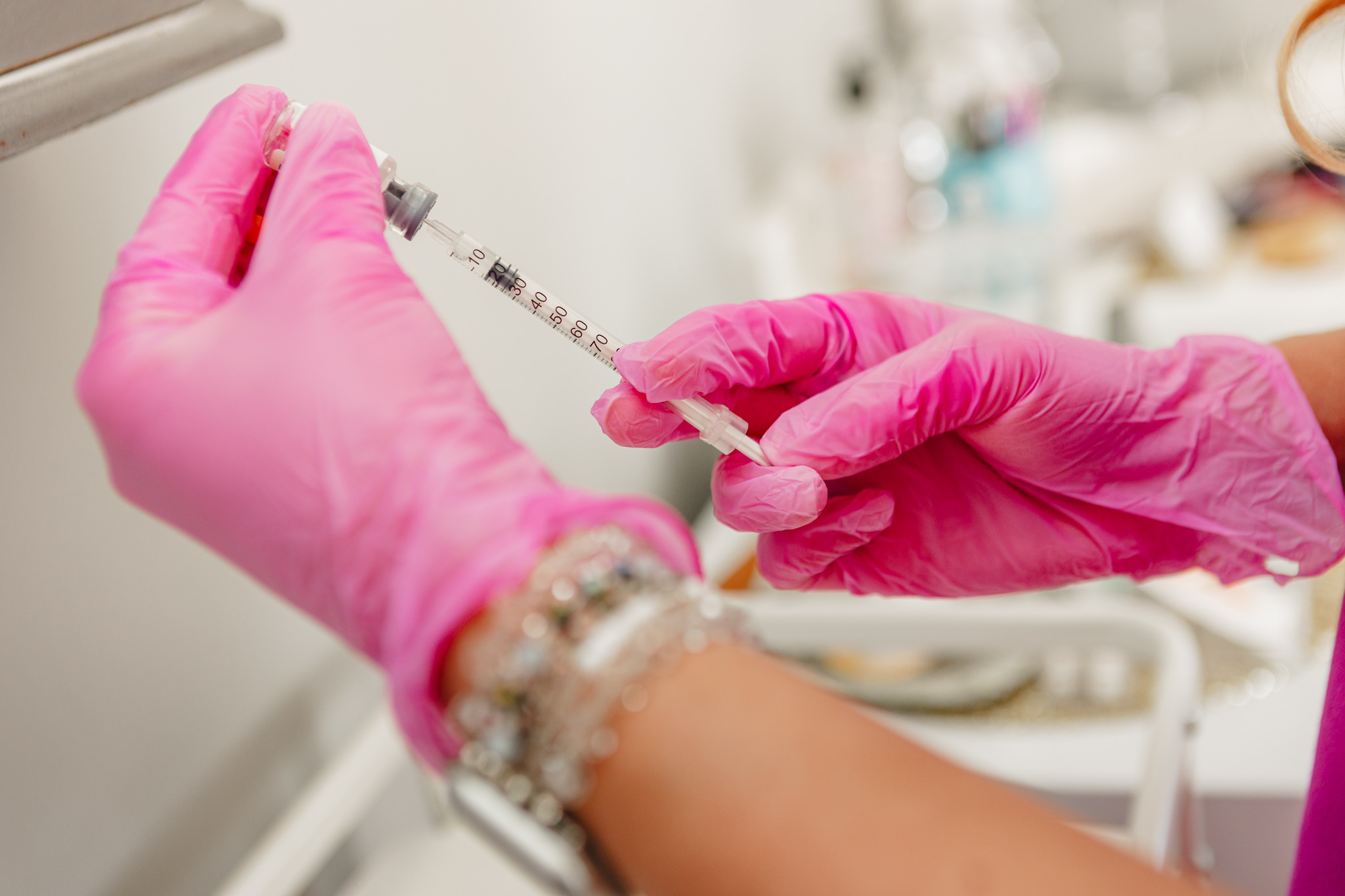 Photo of nurse prepping injectable during branding photoshoot with Fine Line Med Spa in downtown Plymouth.